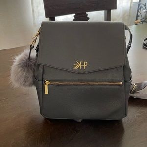 Freshly picked mini diaper bag in stone.